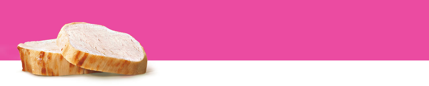 A sliced piece of bread rests on a white surface against a pink background.