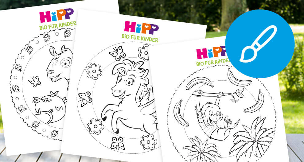 Three coloring book pages featuring a unicorn, a monkey, and a llama are displayed outdoors.